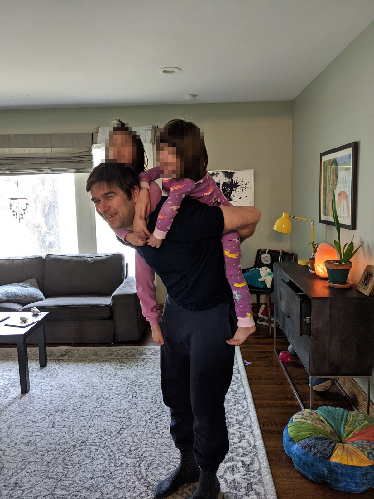Clay Collins giving his daughters a piggyback ride, before chemo started