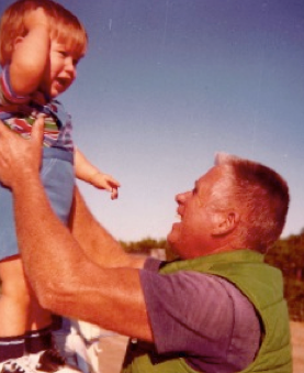 Clay's grandfather holding him as a baby