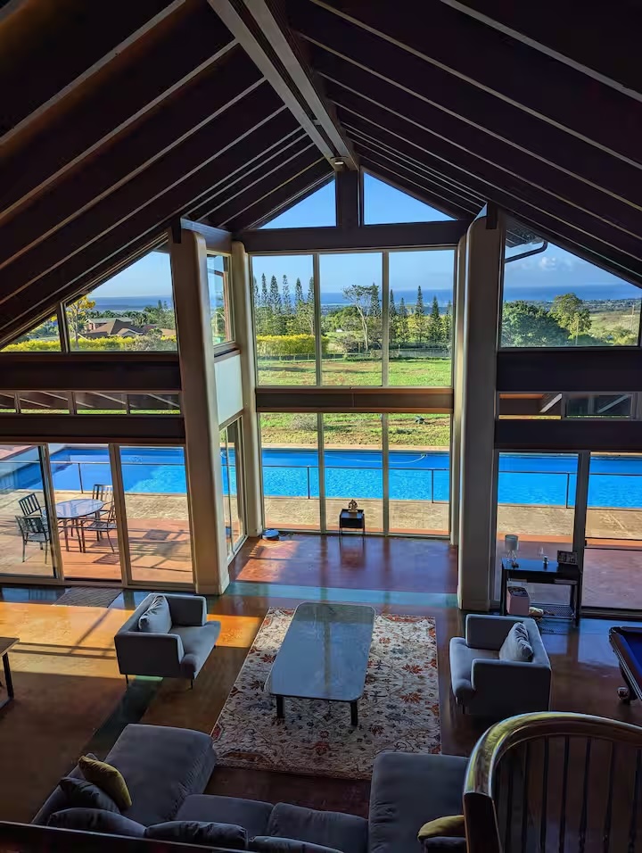 View from the upper level of the great room down to the pool and ocean